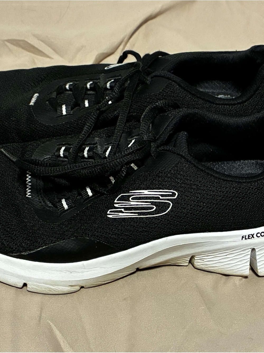 Skechers Women’s Black and White Slip-On Athletic Sneakers